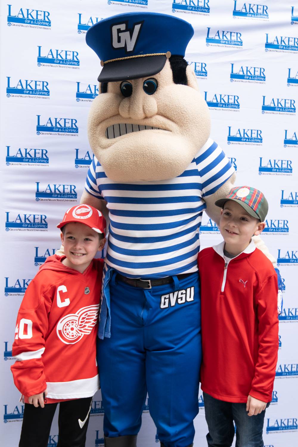Louie the Laker poses with two young boys